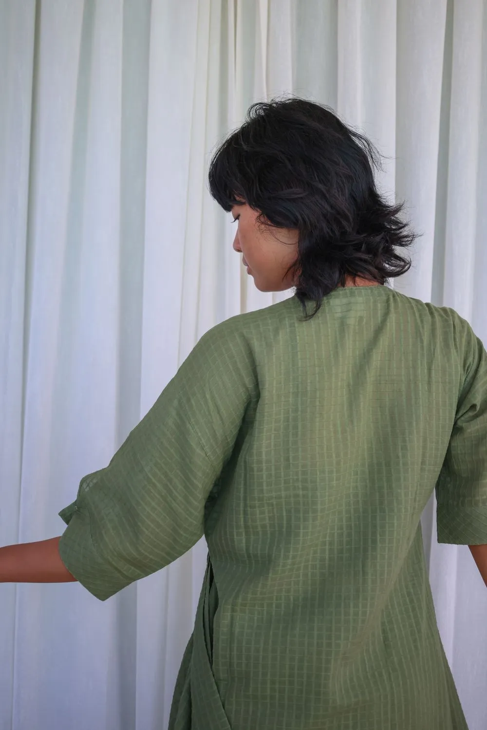Sap green side knotted wrap slit tunic with button embellished sleeve